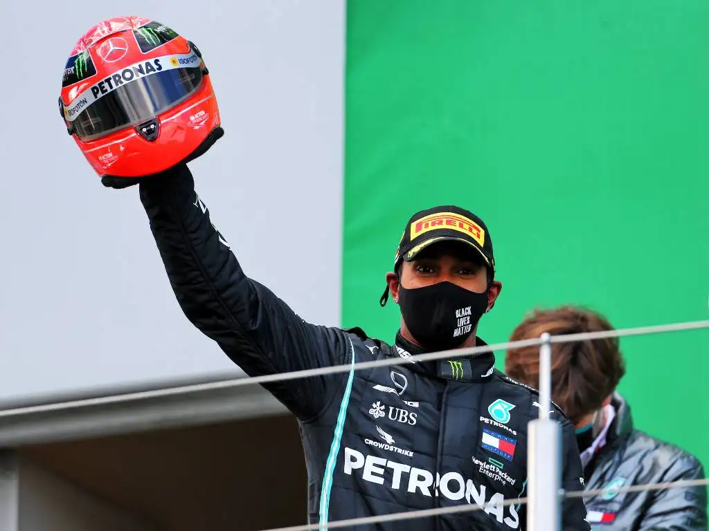 Lewis Hamilton with Michael Schumacher helmet