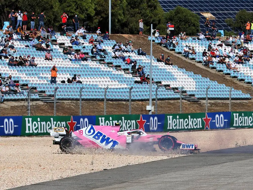 Lance Stroll spins his Racing Point into the gravel after colliding with Max Verstappen during FP2 for the Portuguese Grand Prix
