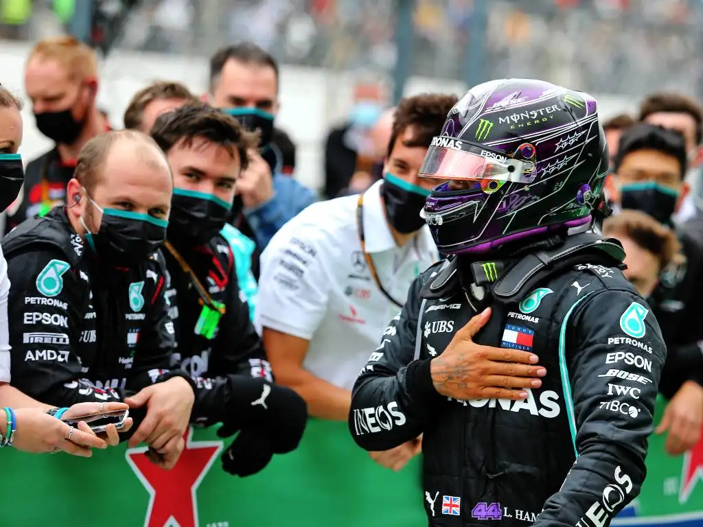 Lewis Hamilton celebrates with the Mercedes team after winning the Portuguese Grand Prix
