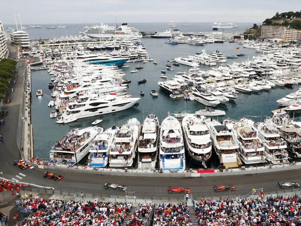 Formula 1 cars pass the harbour during the Monaco Grand Prix