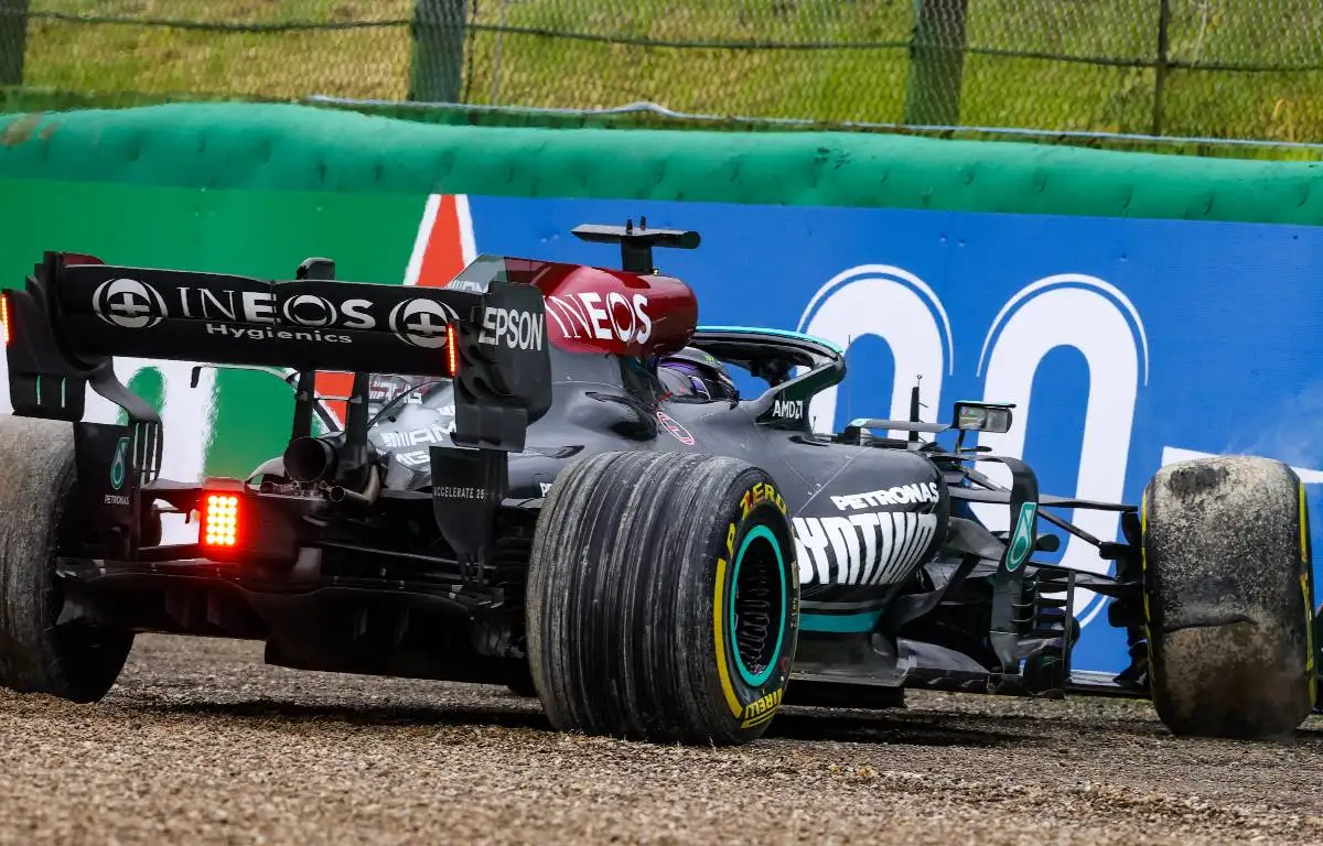 Lewis Hamilton's Mercedes up against the barrier in the Emilia Romagna Grand Prix at Imola before reversing out