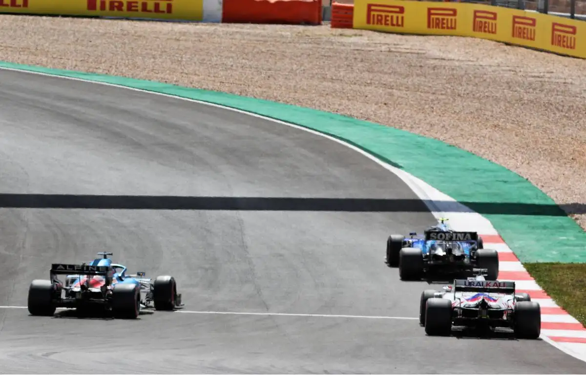 Nicholas Latifi, Williams, followed by Nikita Mazepin, Haas, during 2021 Portuguese Grand Prix qualifying
