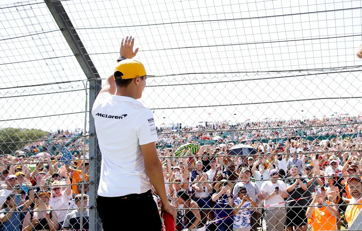 Lando Norris waves to the crowd at the British Grand Prix. Silverstone July 2021