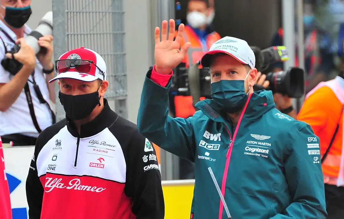 Kimi Raikkonen walking with Sebastian Vettel. Austria July 2021.