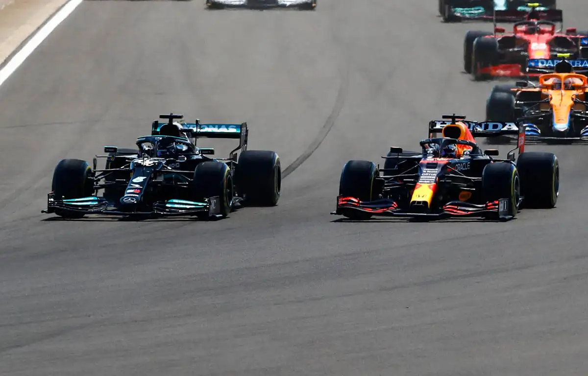 Mercedes' Lewis Hamilton and Red Bull's Max Verstappen battling at Silverstone. July 2021.