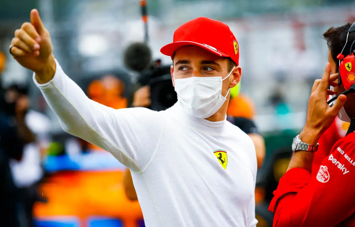 Charles Leclerc salutes the crowd.
