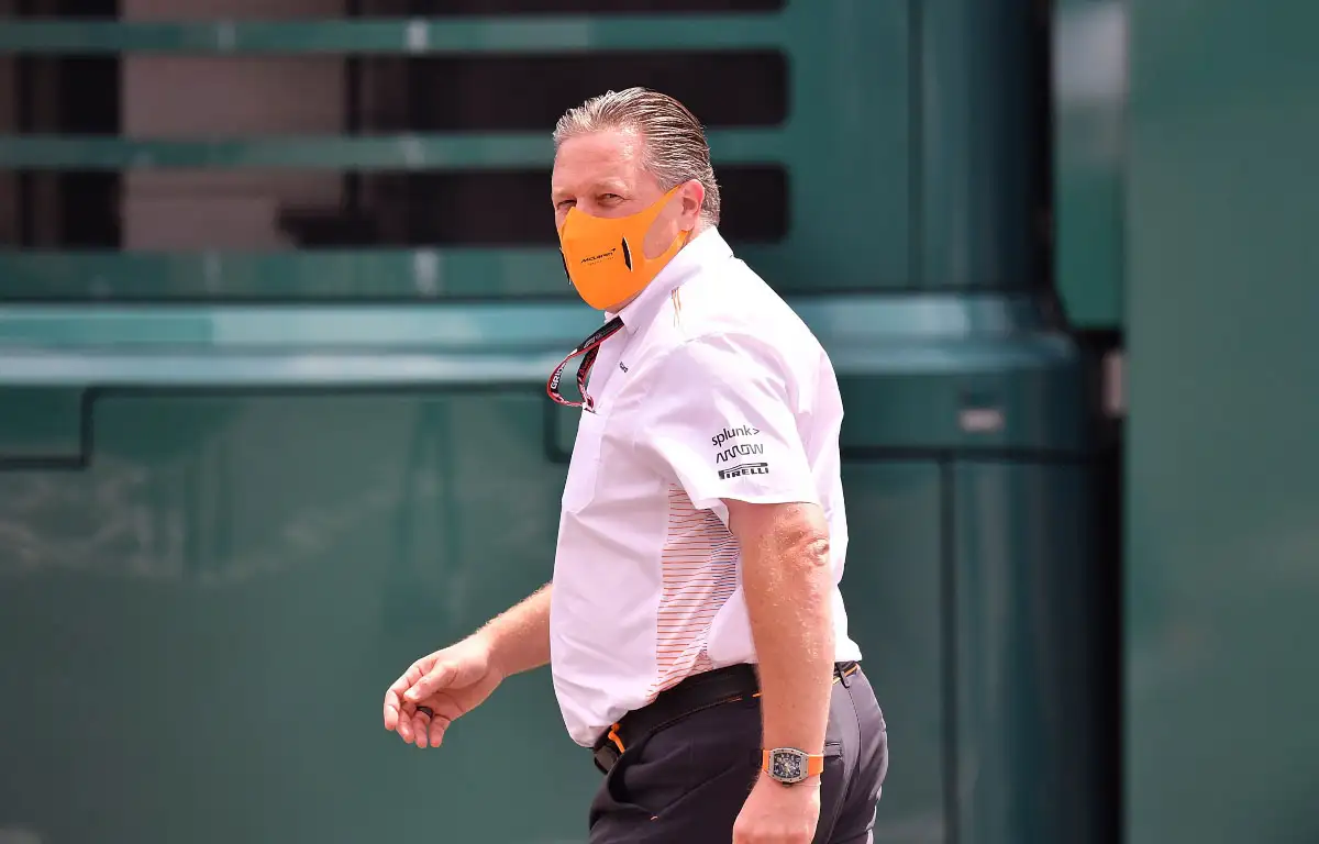 McLaren CEO Zak Brown walks through the paddock.