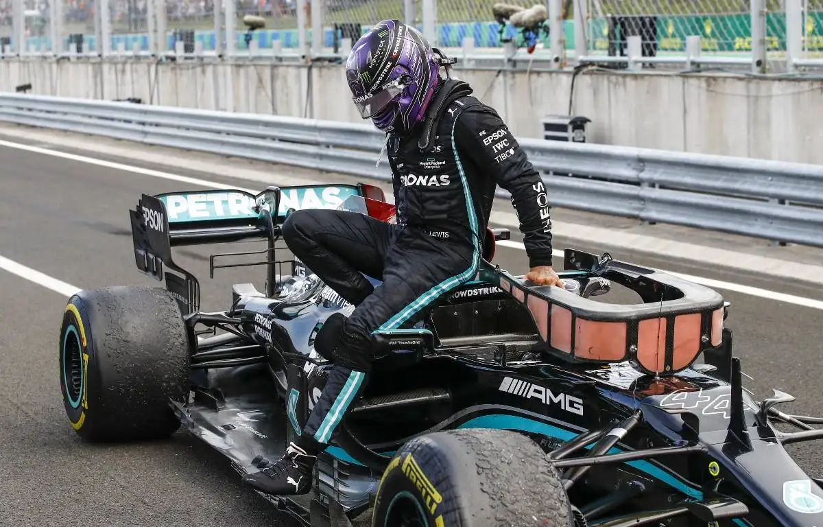 Lewis Hamilton exits the cockpit of his Mercedes W12. Hungary, August 2021.