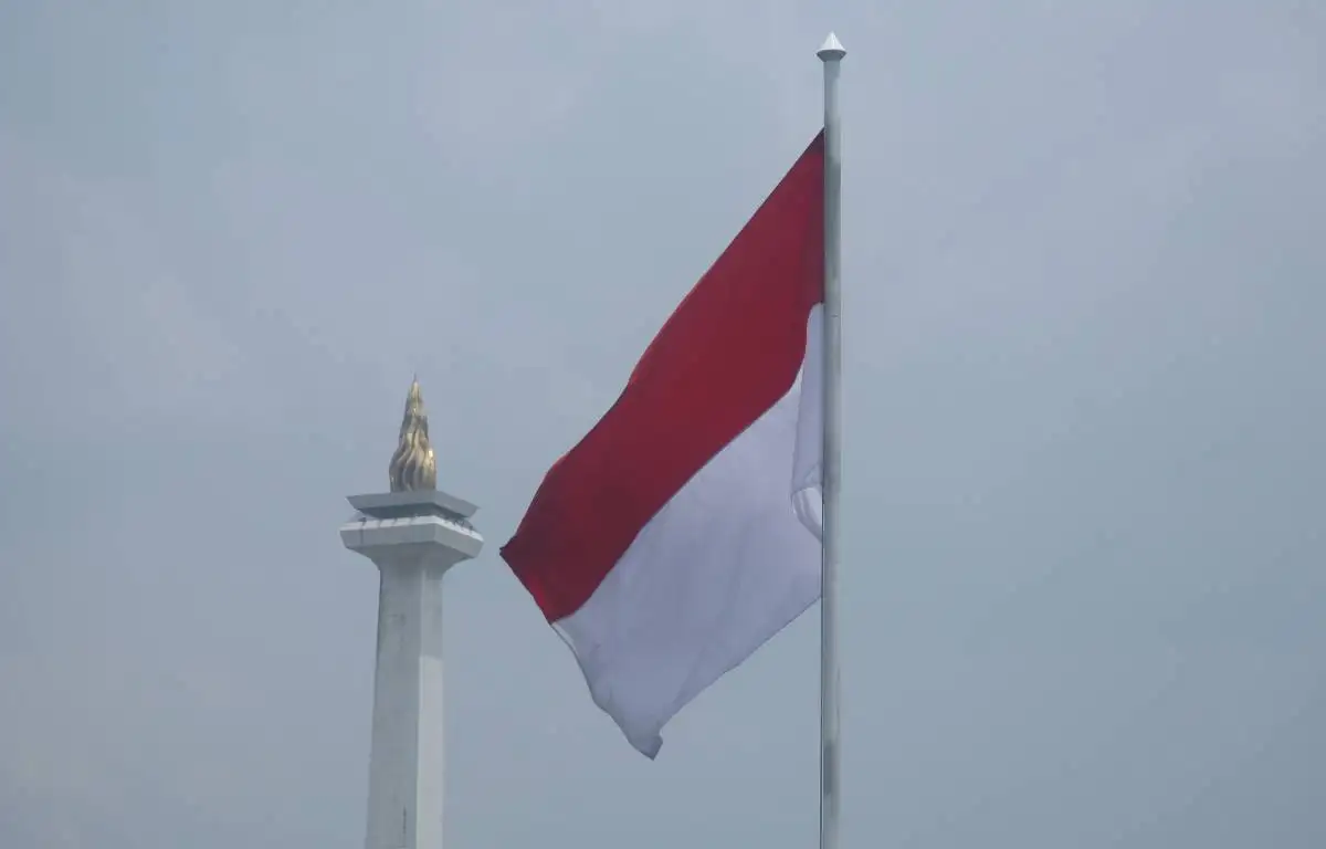Indonesian flag in Jakarta next to the National Monument