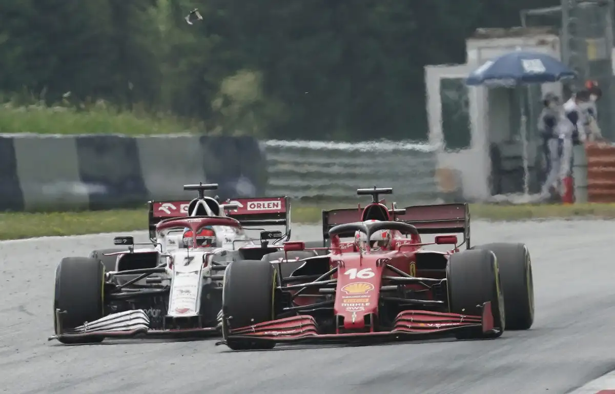 Charles Leclerc [Ferrari] clips Kimi Raikkonen [Alfa Romeo] at the Styrian Grand Prix. June 2021.