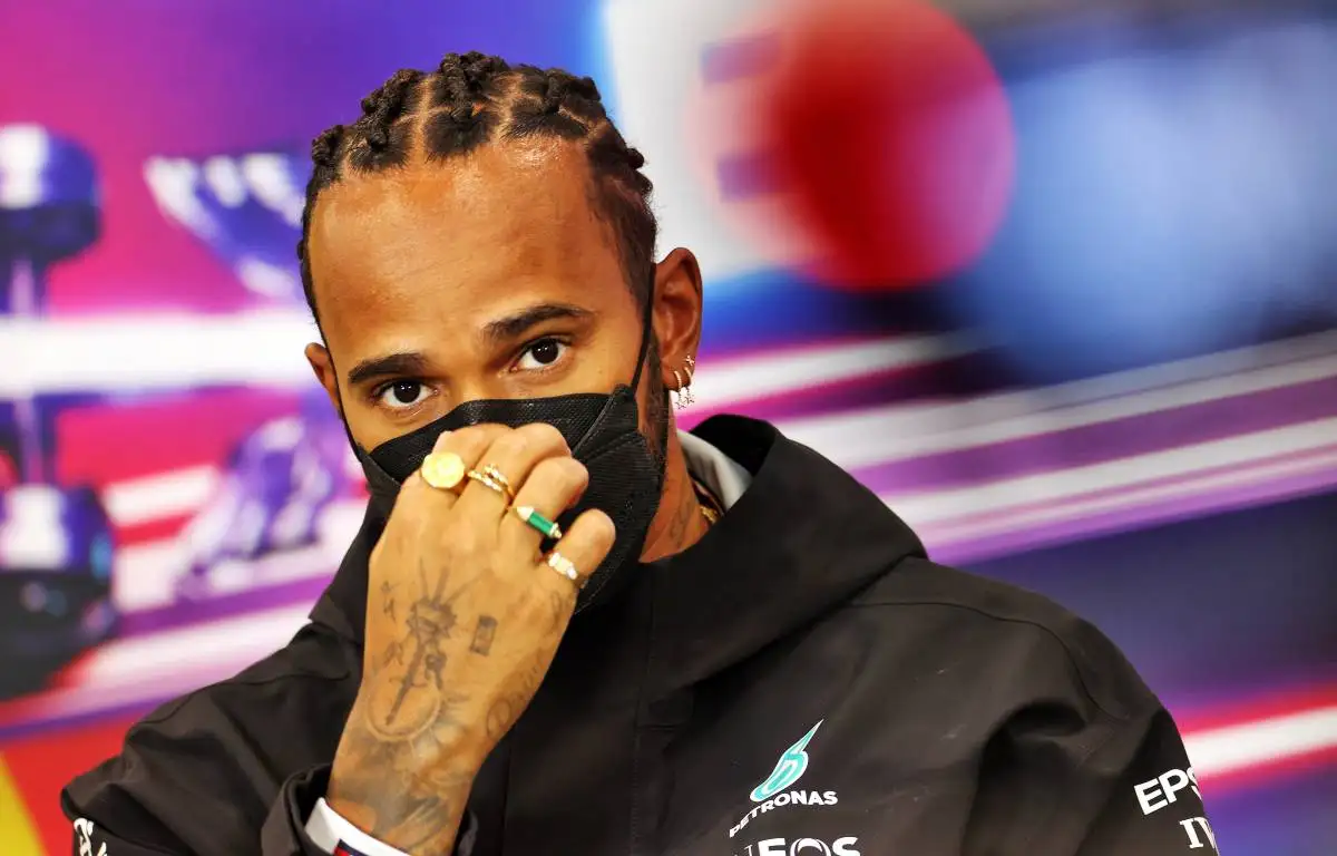 Lewis Hamilton with his hand to his face in a Belgium press conference. August, 2021.