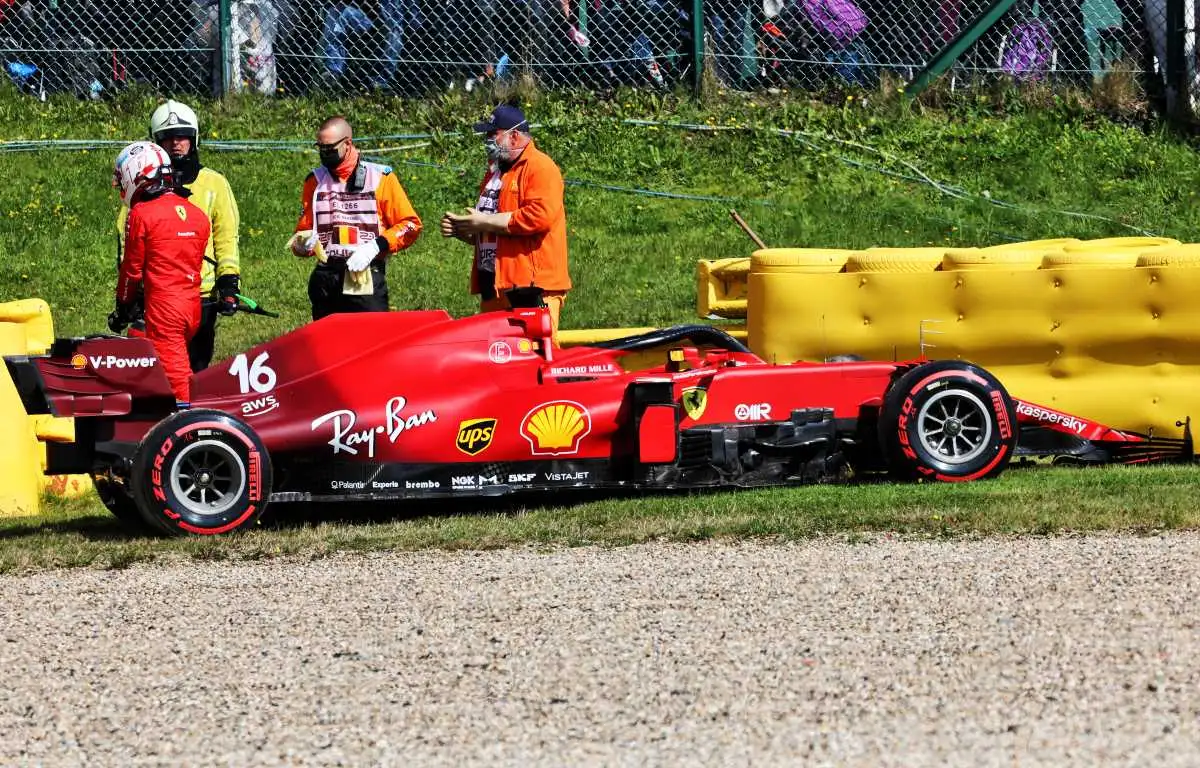 Charles Leclerc walks away from his Ferrari after crashing in Belgian GP practice, August, 2021.