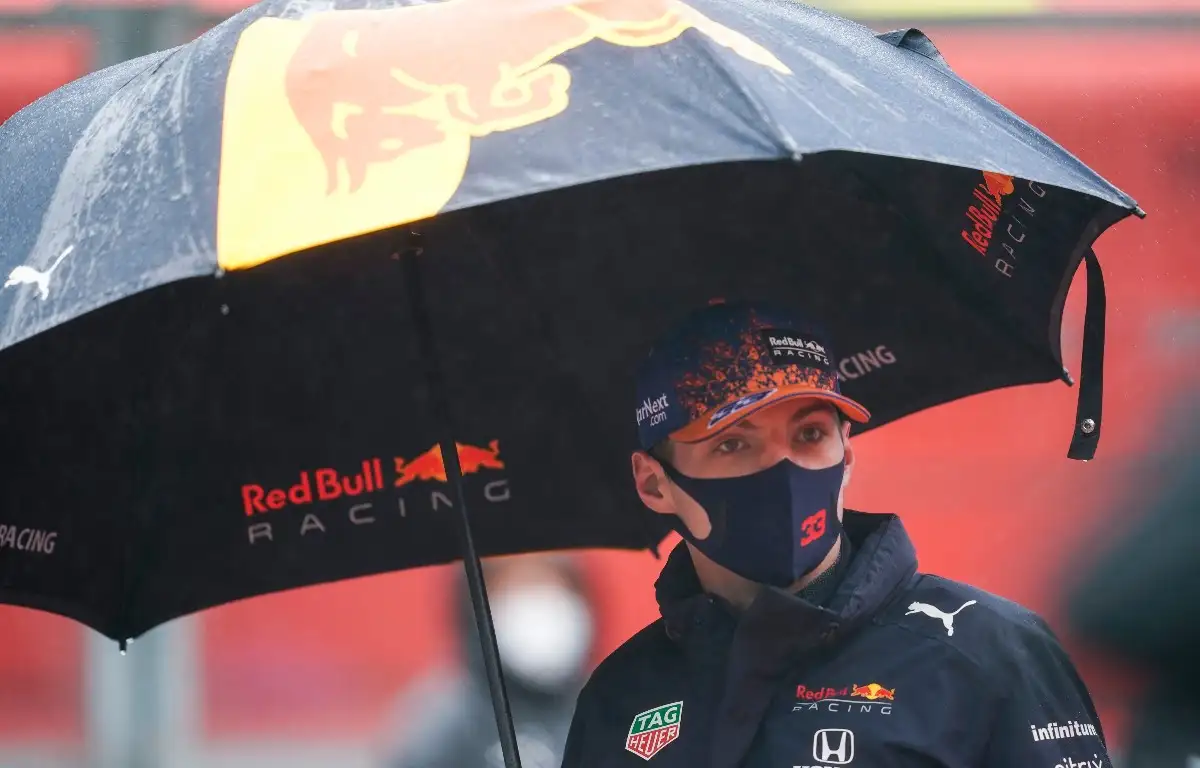 Max Verstappen holding an umbrella. Belgium August 2021