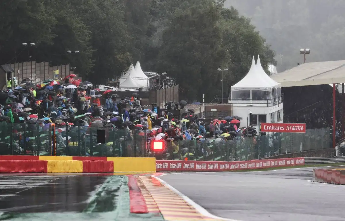 Fans holding umbrellas at the wet Belgian GP. August 2021.