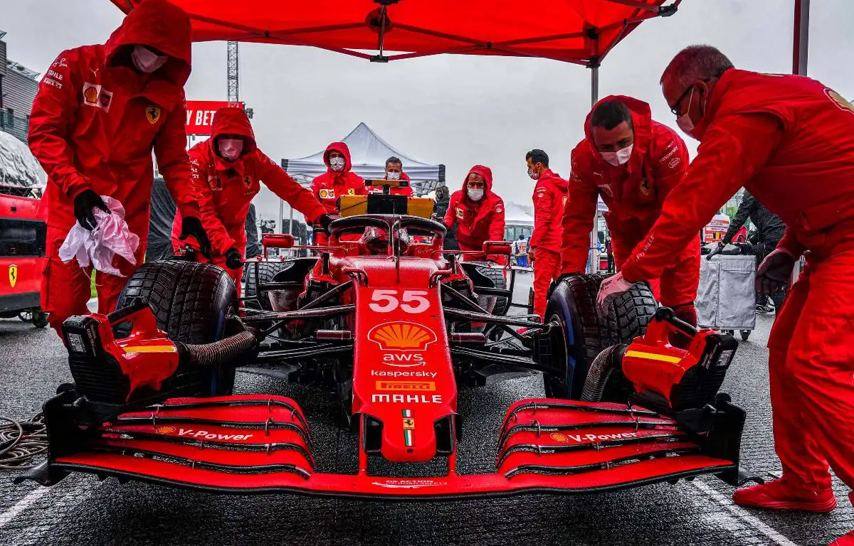 Carlos Sainz and his Ferrari crew prepare for a wet Belgian GP. August 2021.