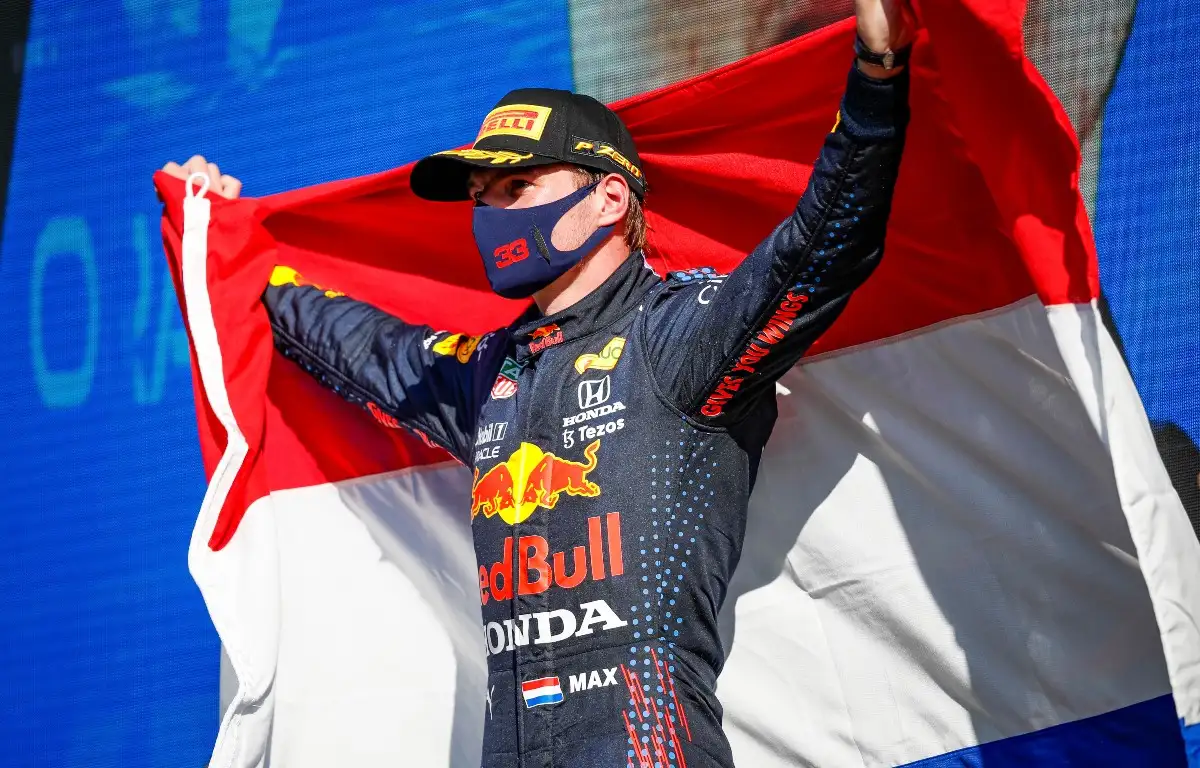 Max Verstappen holding a Dutch flag in celebration. Netherlands September 2021
