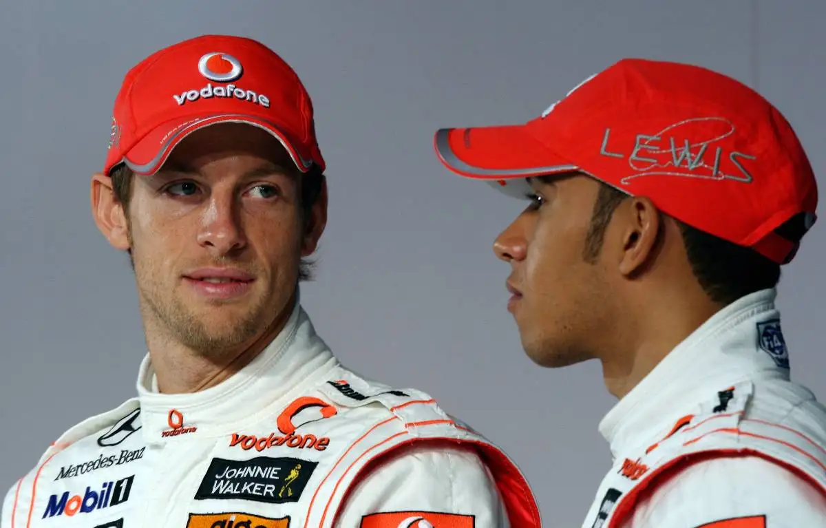 Jenson Button looking at Lewis Hamilton during a McLaren team launch. Woking January 2010.