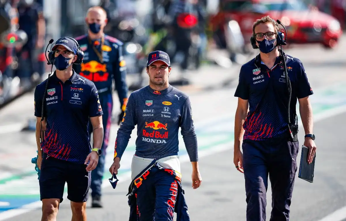 Sergio Perez with Red Bull colleagues in the pit lane. Monza September 2021.