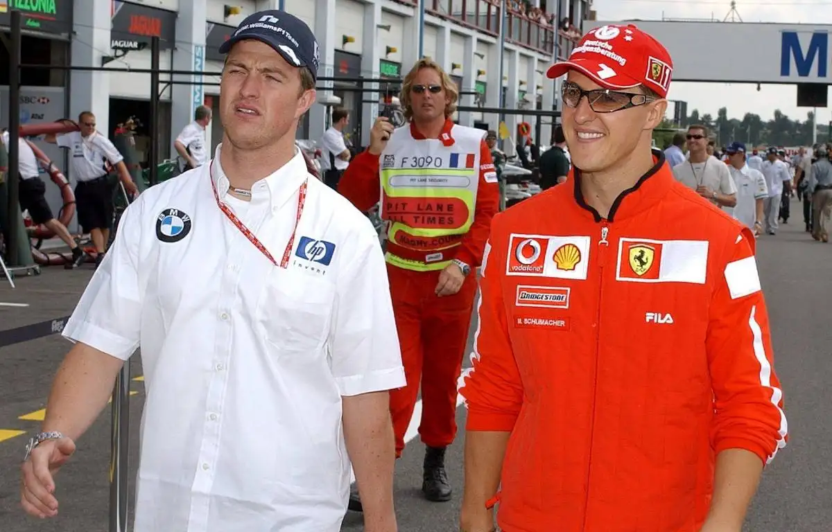 Ralf Schumacher and Michael Schumacher at the French GP. Magny-Cours July 2002.