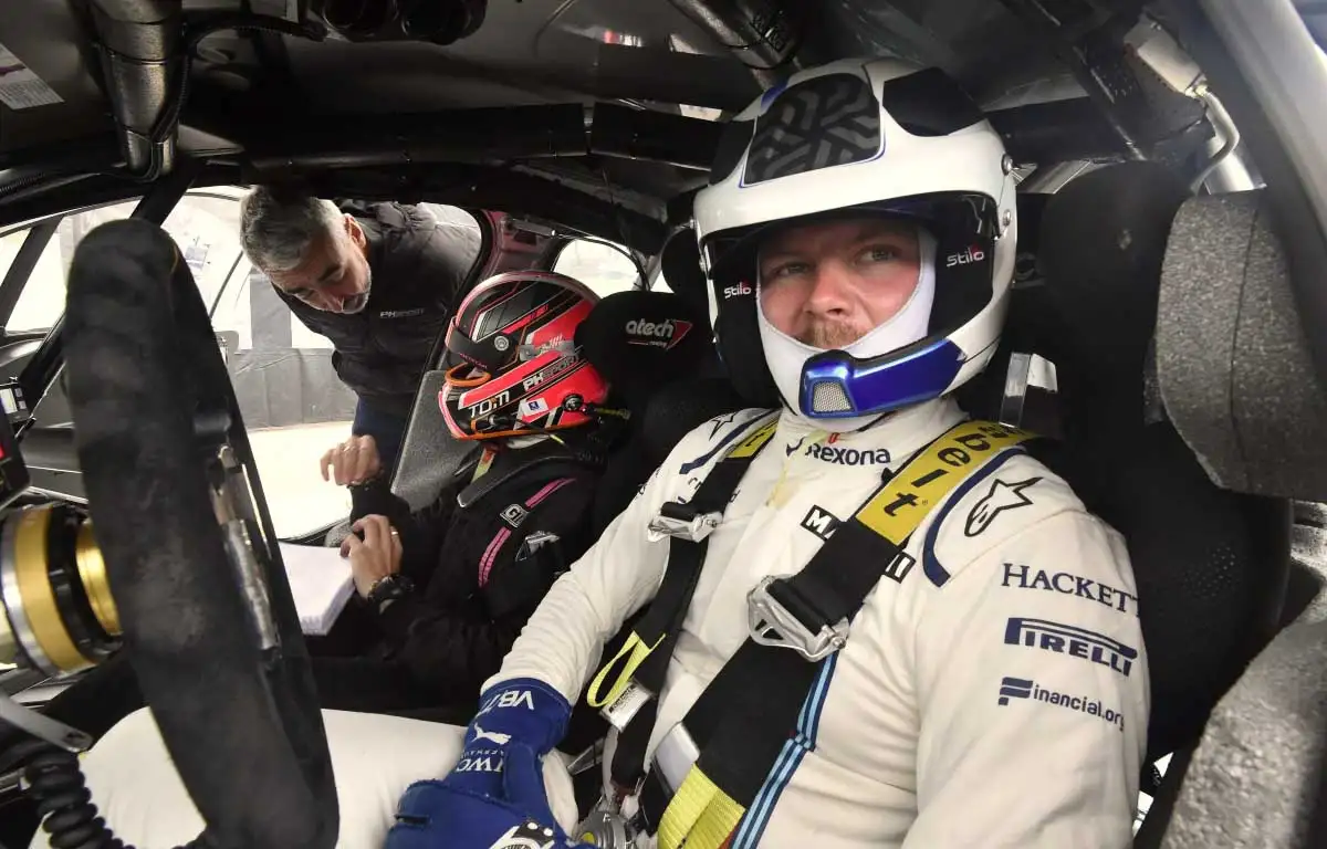 Valtteri Bottas behind the wheel of a rally car.