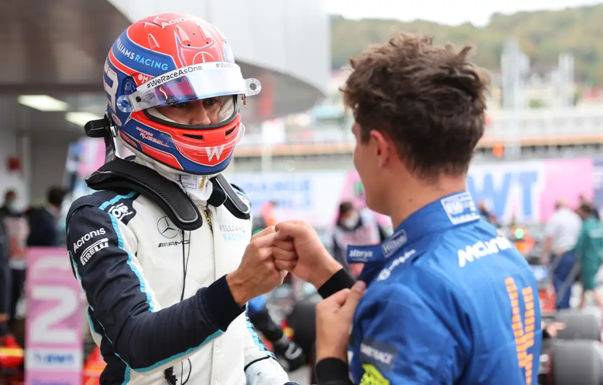 George Russell fist bumps with Lando Norris. Russia September 2021