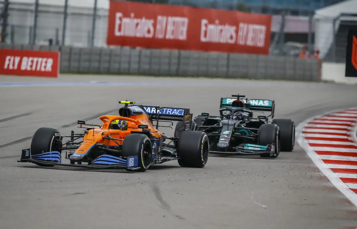 Lando Norris defends the Russian GP lead from Lewis Hamilton. September 2021.