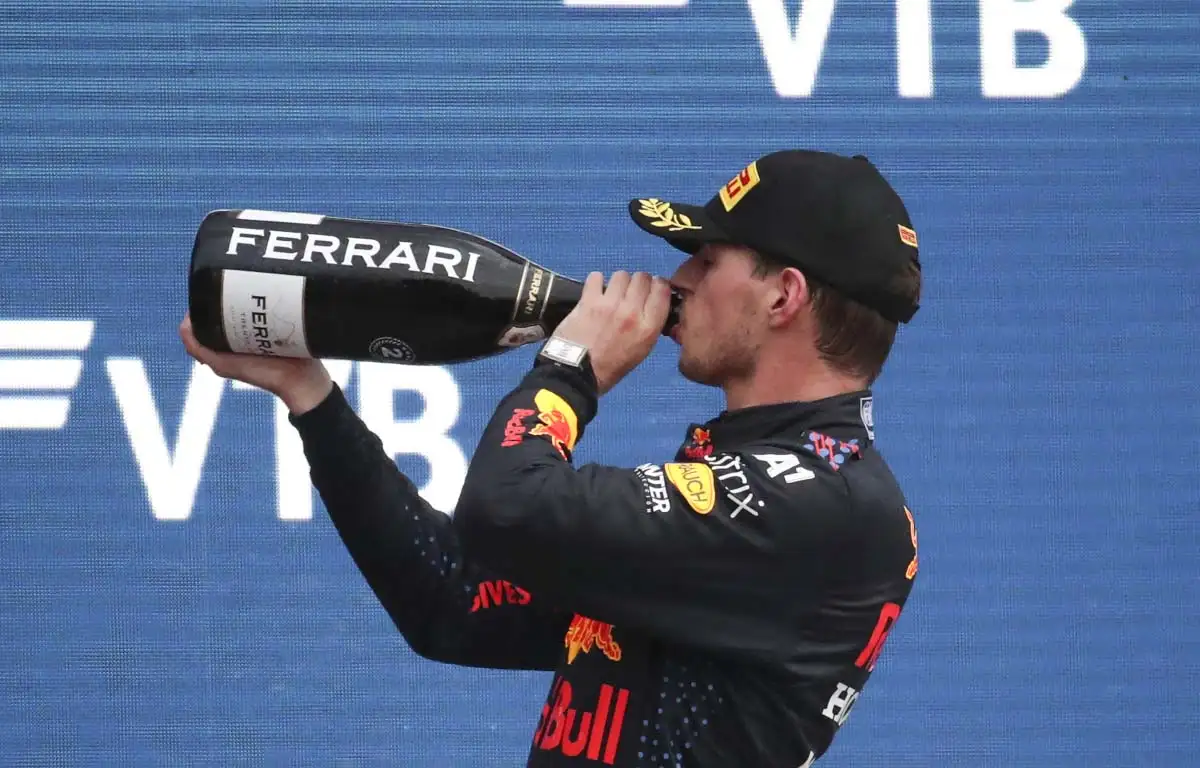Max Verstappen drinks champagne in Russia.
