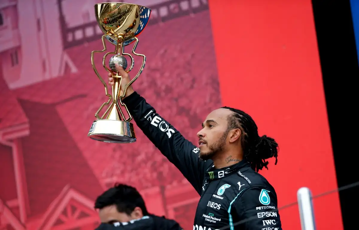 Lewis Hamilton lifting the trophy after winning in Sochi. Russia September 2021