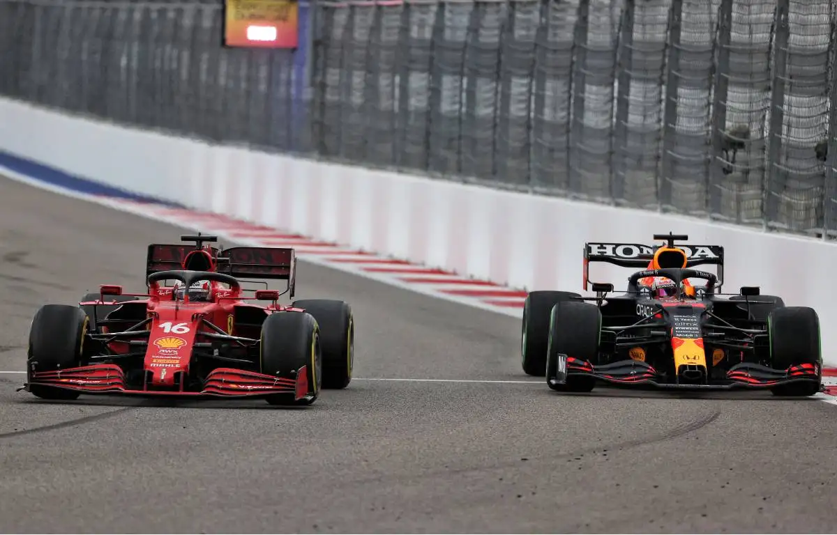 Charles Leclerc's Ferrari alongside Max Verstappen's Red Bull during the Russian GP. Sochi September 2021.