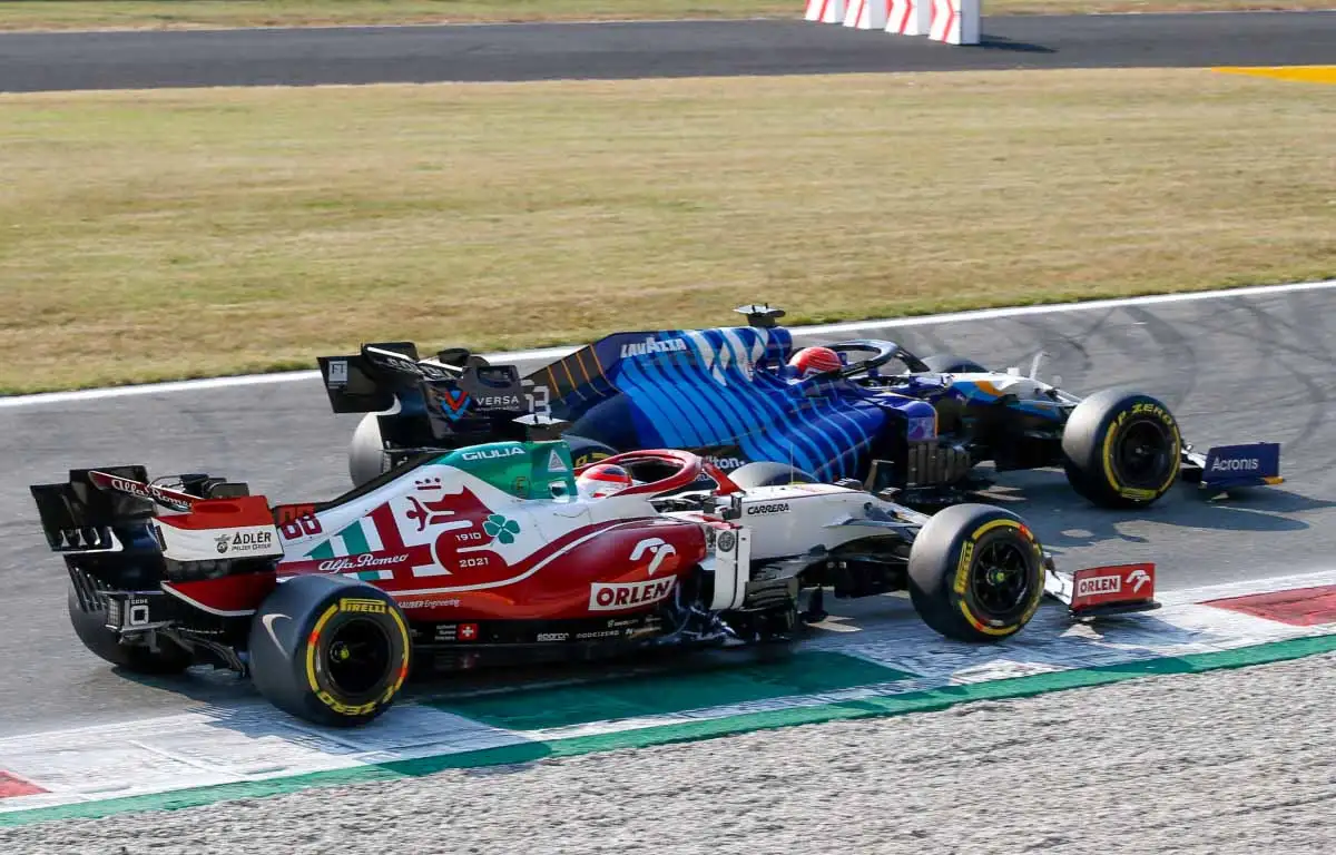 Williams' George Russell and Alfa Romeo's Antonio Giovinazzi at the 2021 Italian GP.