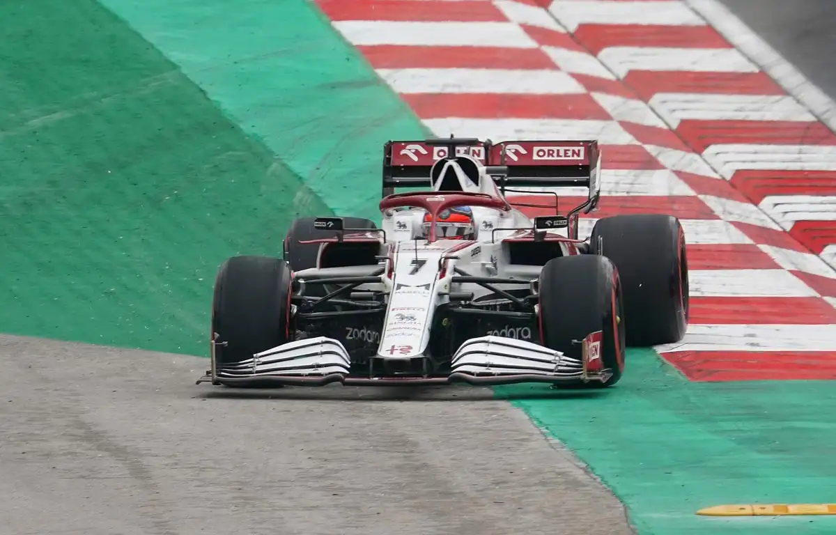 Kimi Raikkonen runs wide at Turn 1 in his Alfa Romeo. Istanbul October 2021.