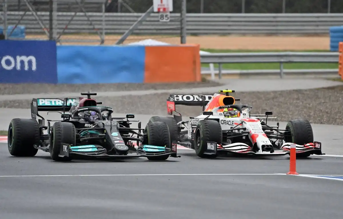 Sergio Perez defends from the pit entry against Lewis Hamilton. Turkey, October 2021.