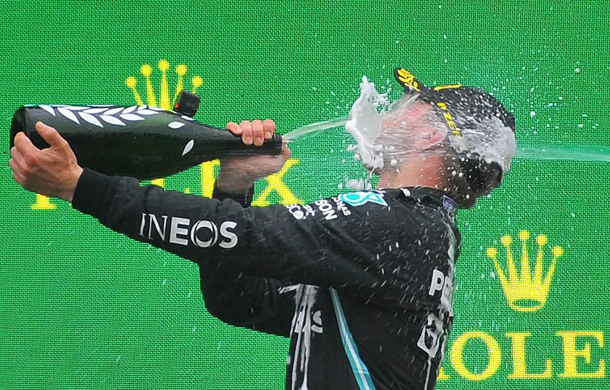 Valtteri Bottas, Mercedes, takes a face full of champagne. Turkey, October 2021.