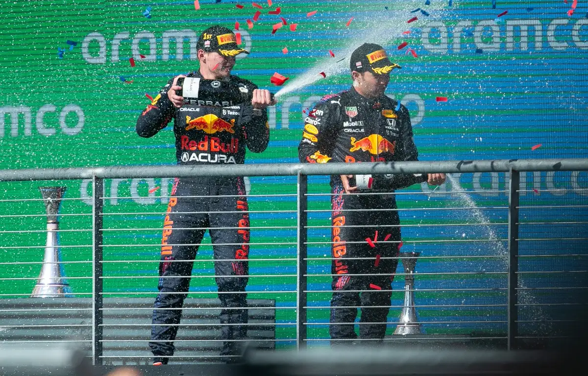 Max Verstappen and Sergio Perez spraying champagne. Austin October 2021