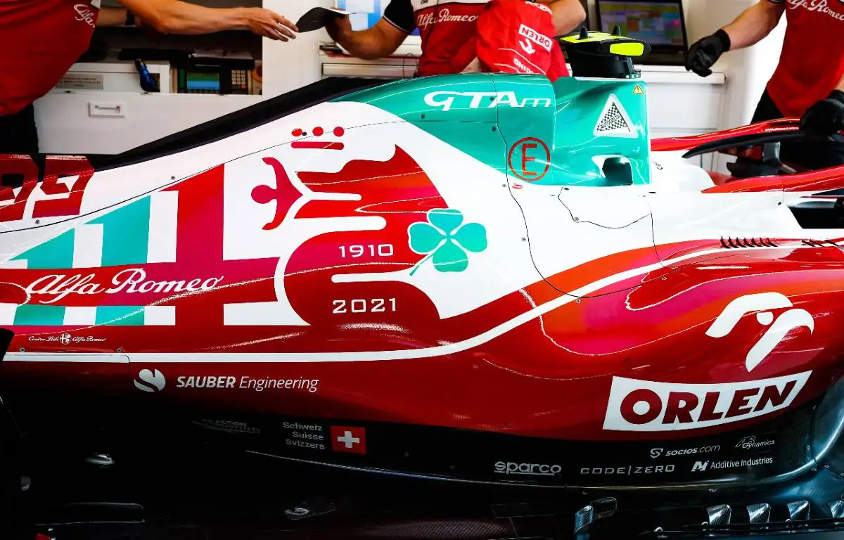 Mechanics work on an Alfa Romeo car at the Italian GP. Monza September 2021.