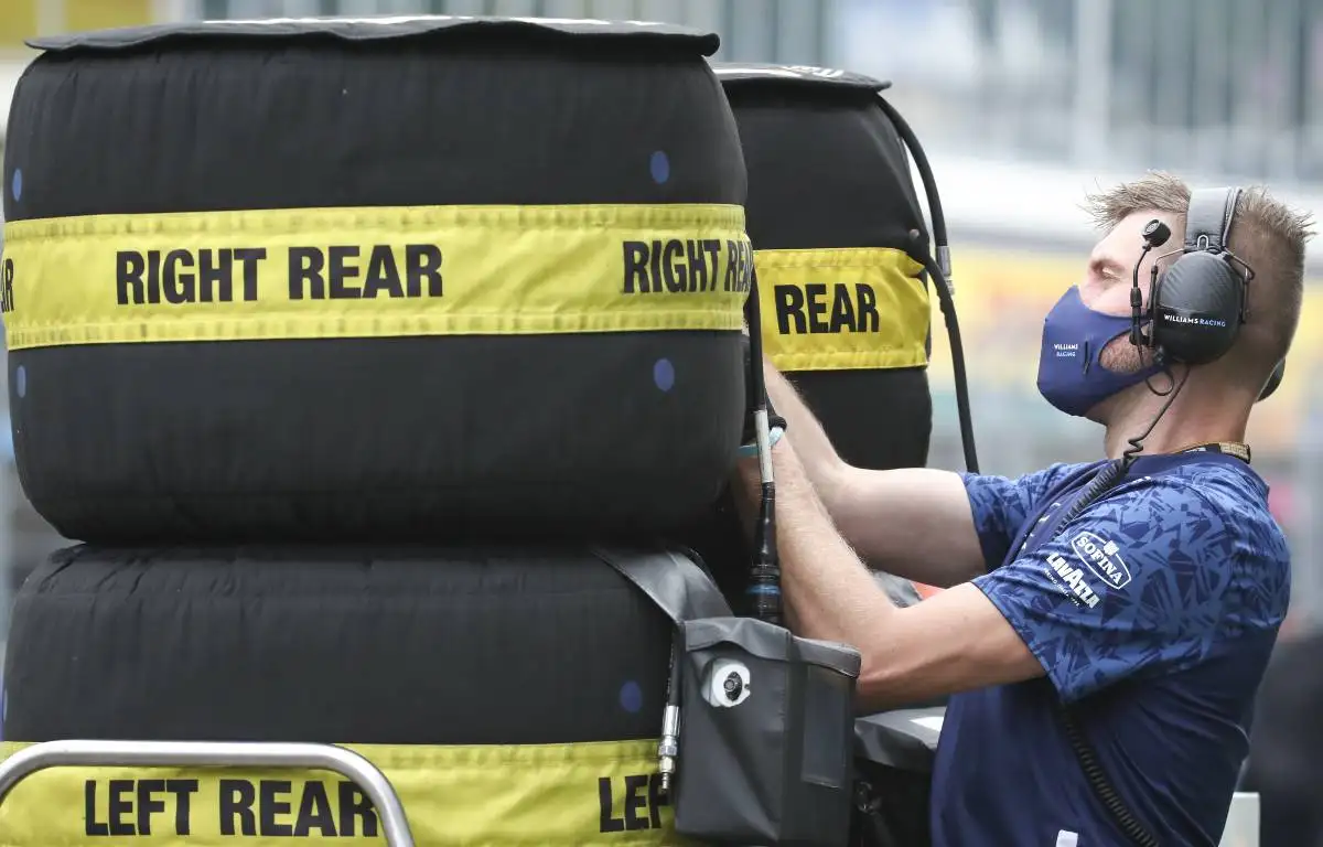 A mechanic attends to a supply of tyres at the Russian GP. Sochi September 2021.