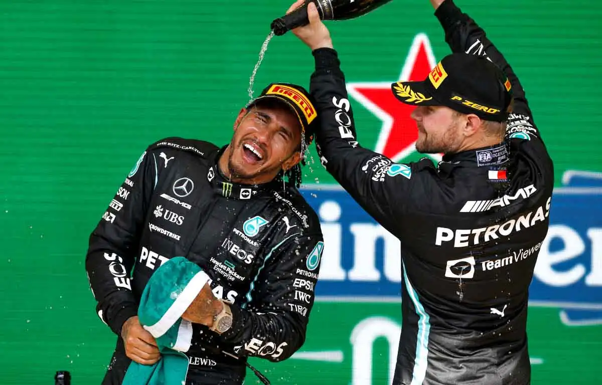 Valtteri Bottas pours champagne on Lewis Hamilton. Sao Paulo November 2021.
