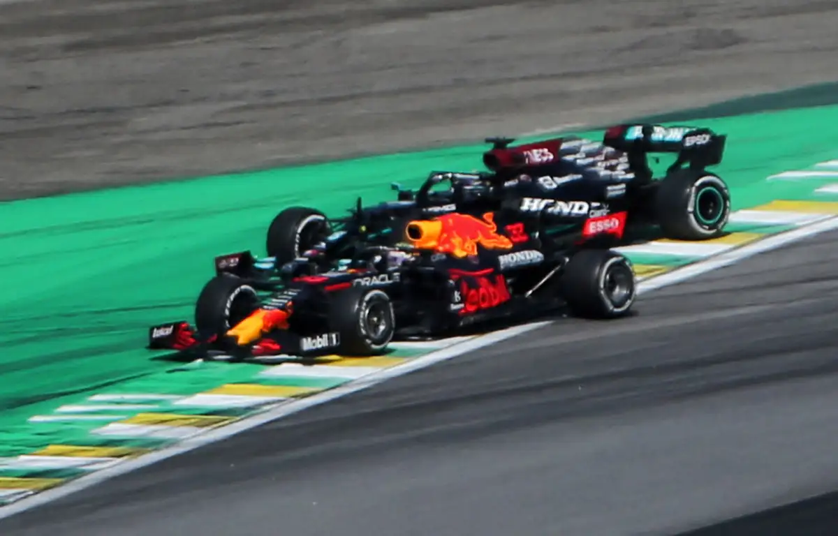 Red Bull driver Max Verstappen and Mercedes driver Lewis Hamilton about to run wide. Brazil November 2021