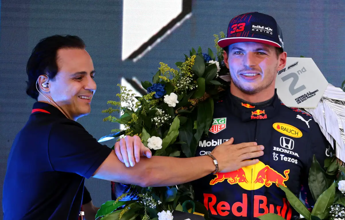 Felipe Massa presents Max Verstappen with wreath. Brazil November 2021