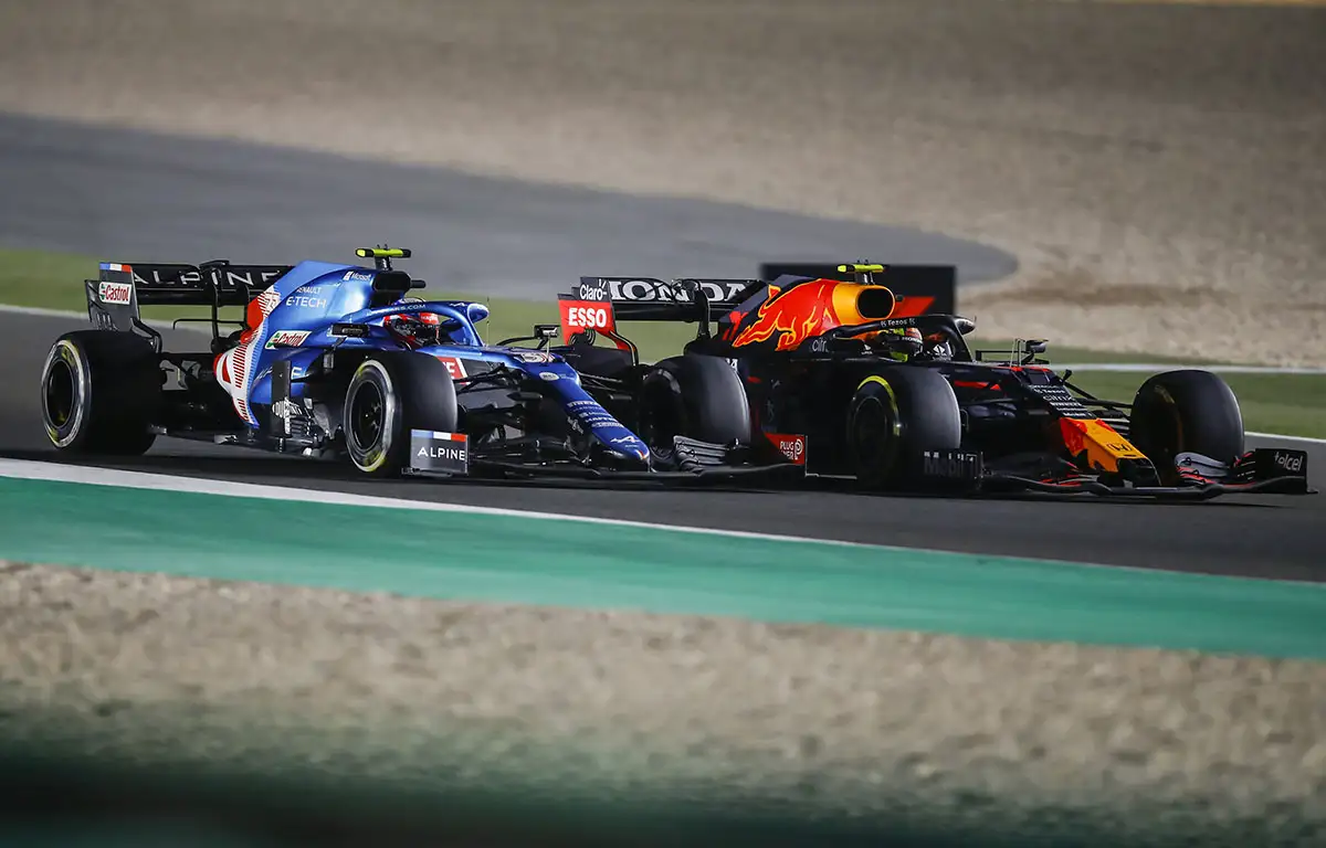 Esteban Ocon and Sergio Perez fight on track. Qatar November 2021
