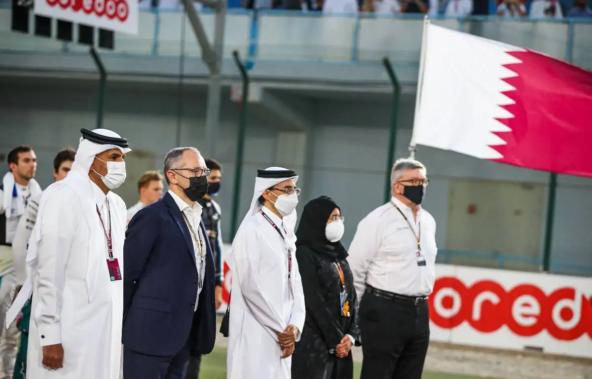 Stefano Domenicali and Ross Brawn join dignitaries in standing for the Qatar national anthem. Lusail November 2021.