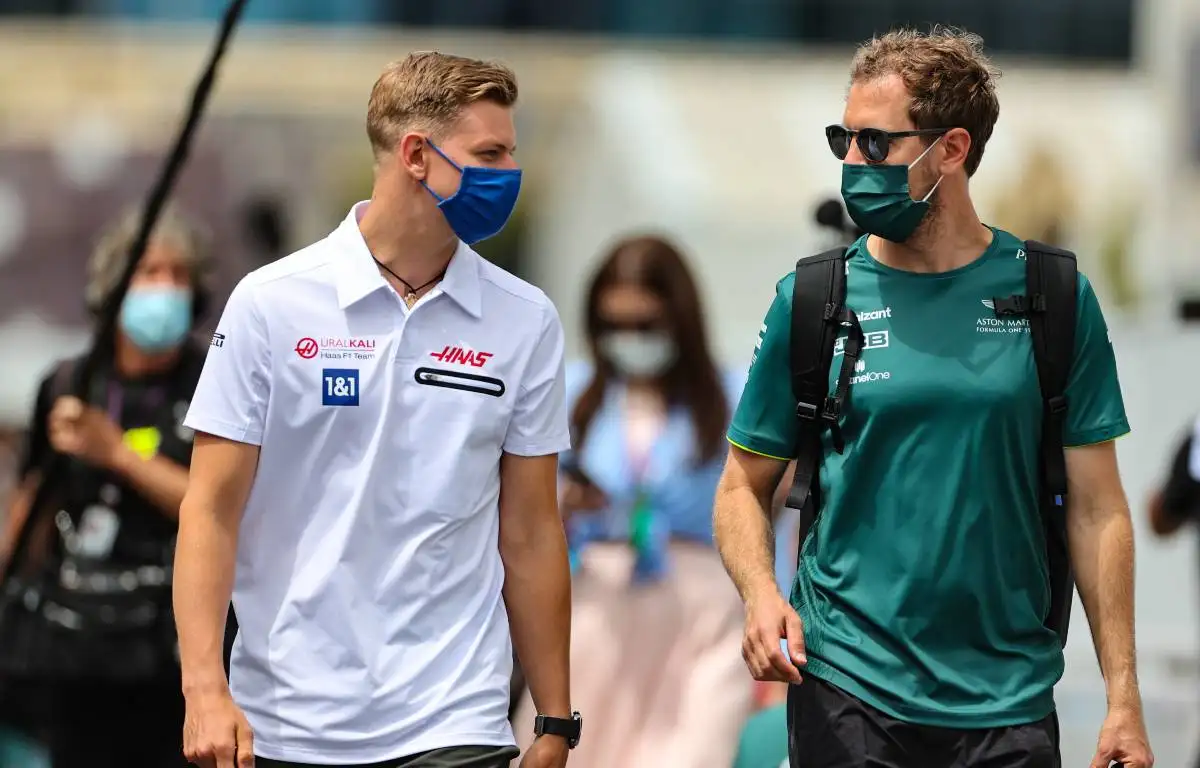 Mick Schumacher and Sebastian Vettel walking and talking. Baku June 2021.