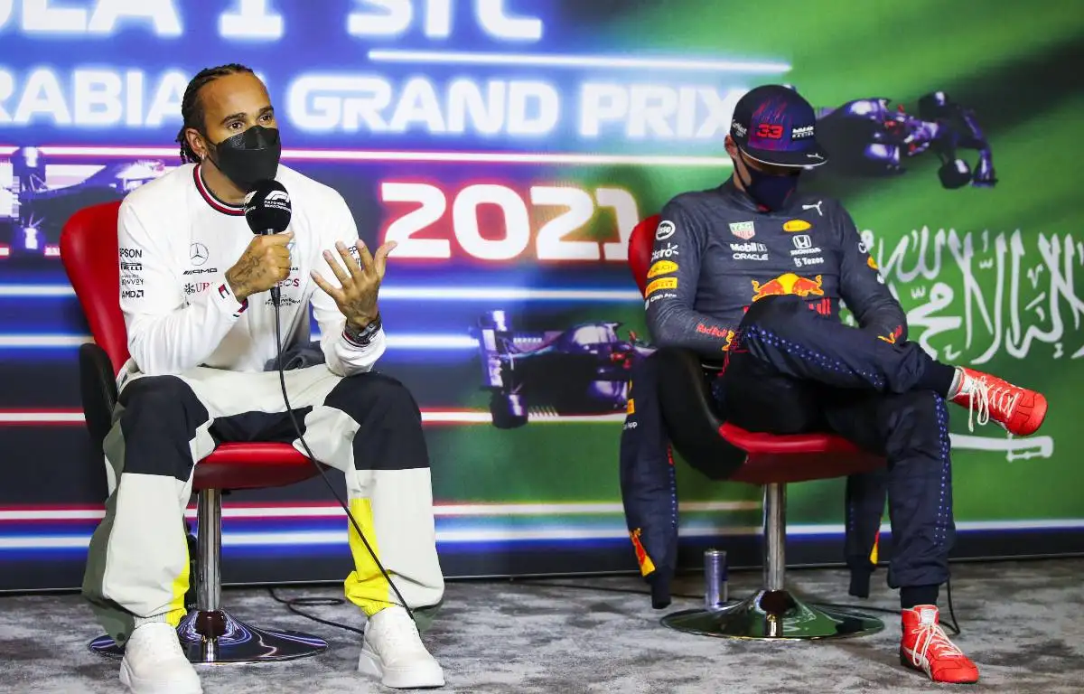 Lewis Hamilton, Mercedes, talks, Max Verstappen, Red Bull, head down. Saudi Arabia, December 2021.