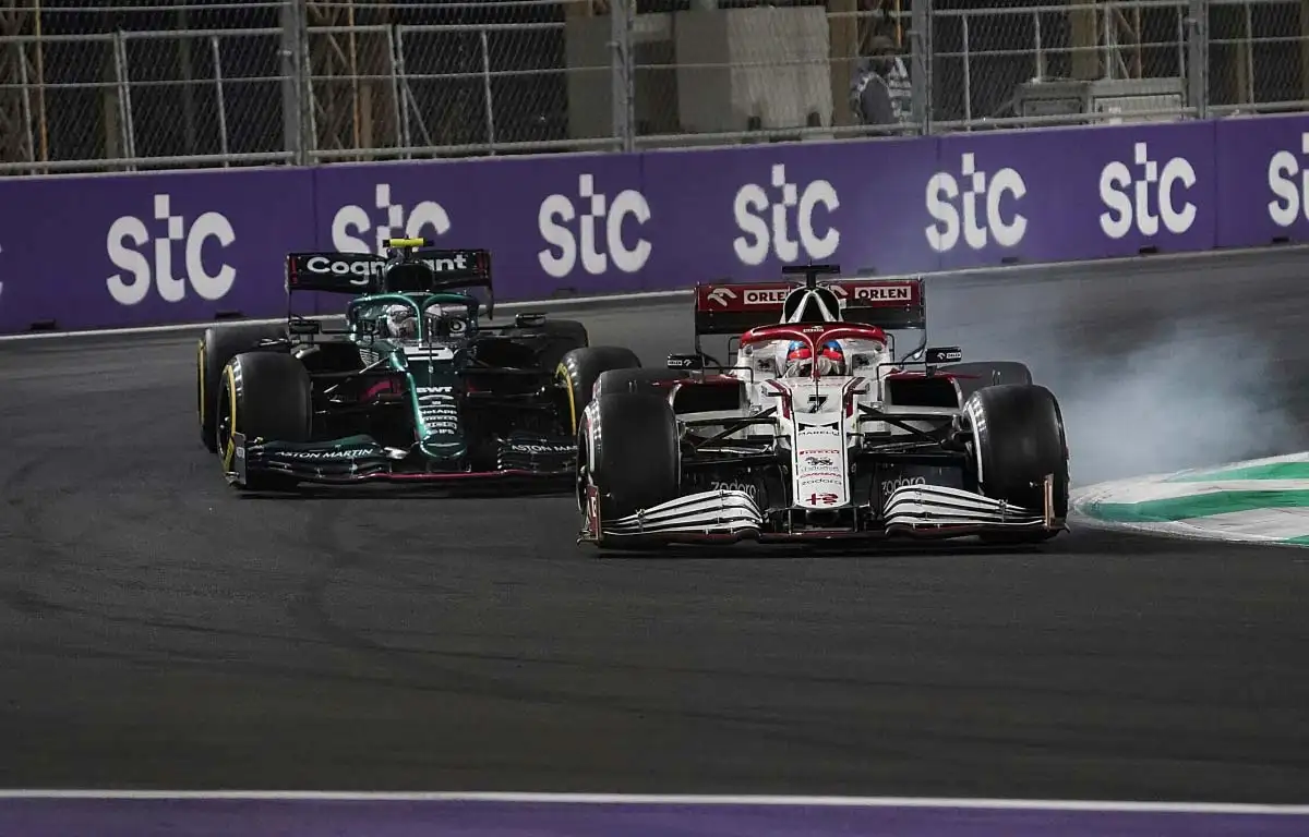 Kimi Raikkonen passes Sebastian Vettel. at Turn 1. Jeddah December 2021.