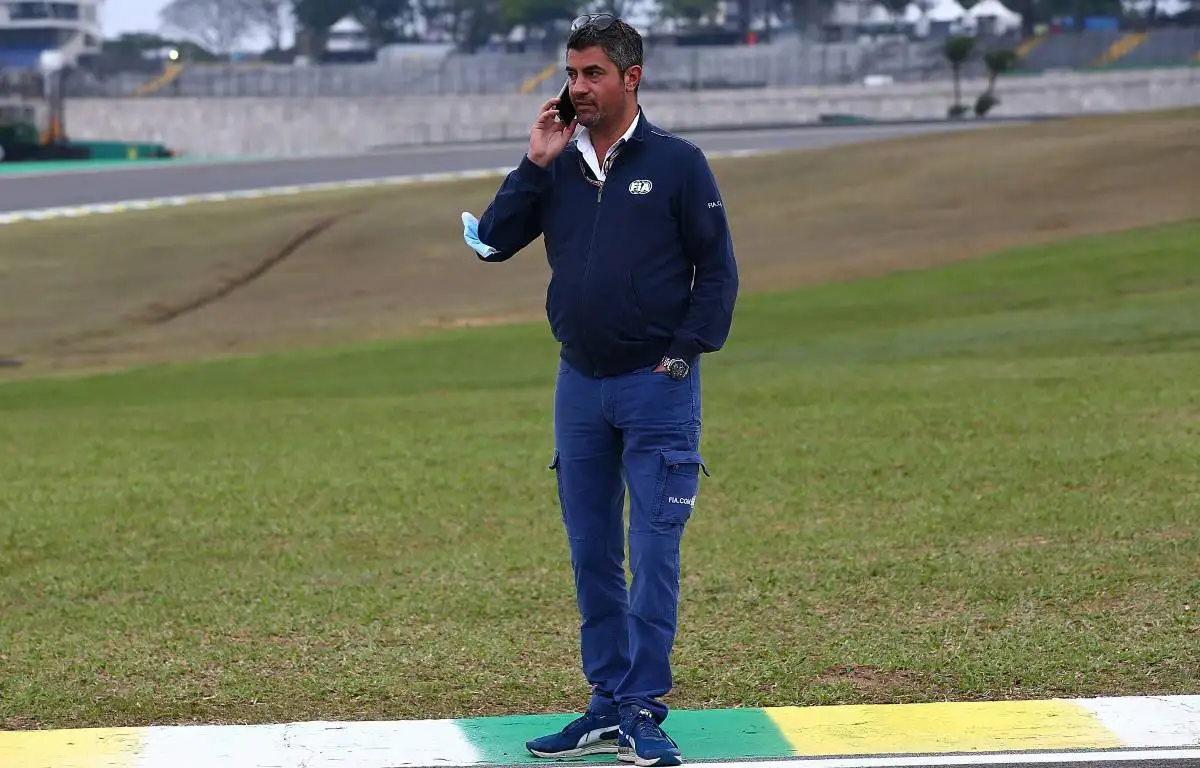 FIA race director Michael Masi talking on phone at the Brazilian GP. Interlagos November 2021.