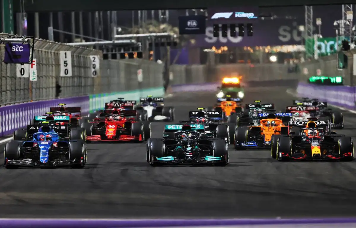 Cars head to turn one on the second restart of the Saudi Arabian GP. Jeddah December 2021.