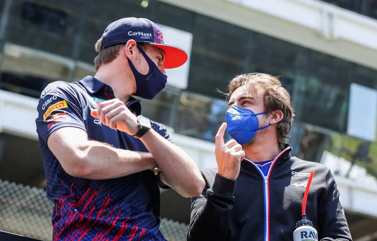 Max Verstappen and Fernando Alonso talk. Brazil, November 2021.