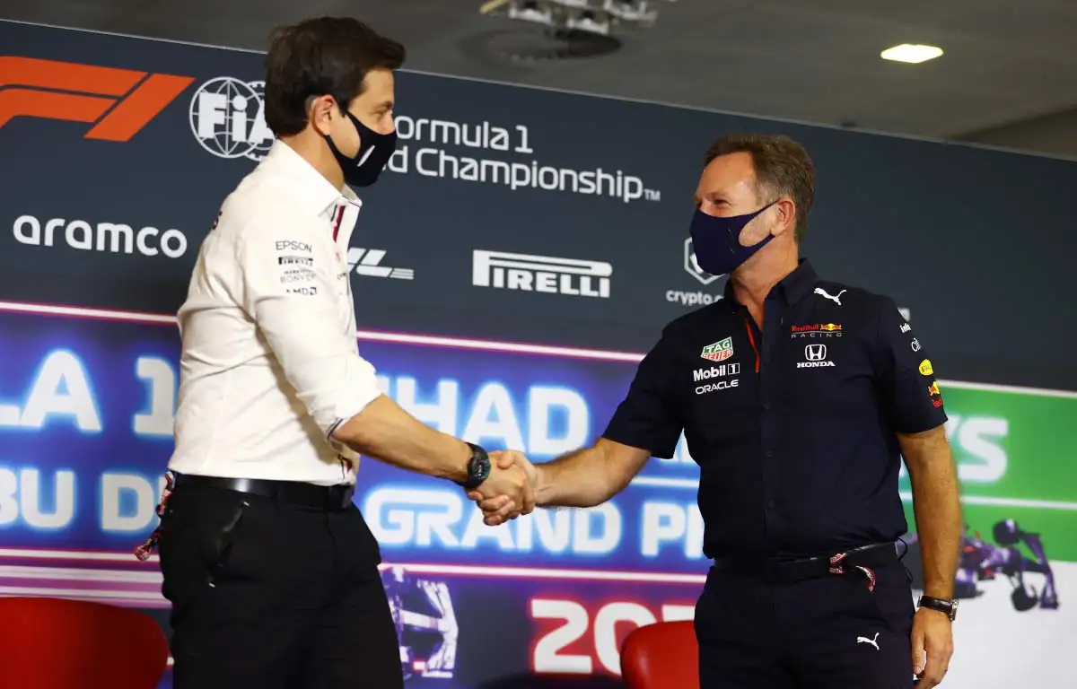 Toto Wolff and Christian Horner shake hands. Abu Dhabi December 2021.