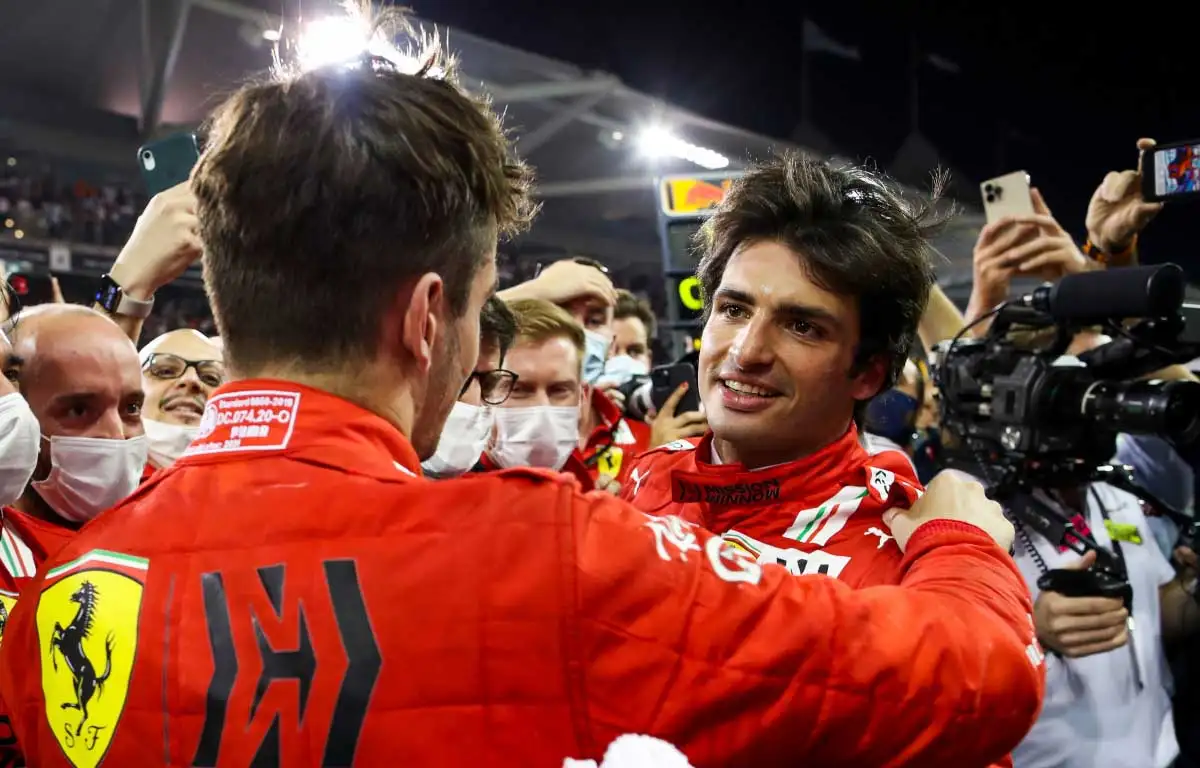 Charles Leclerc and Carlos Sainz embrace. Abu Dhabi December 2021.