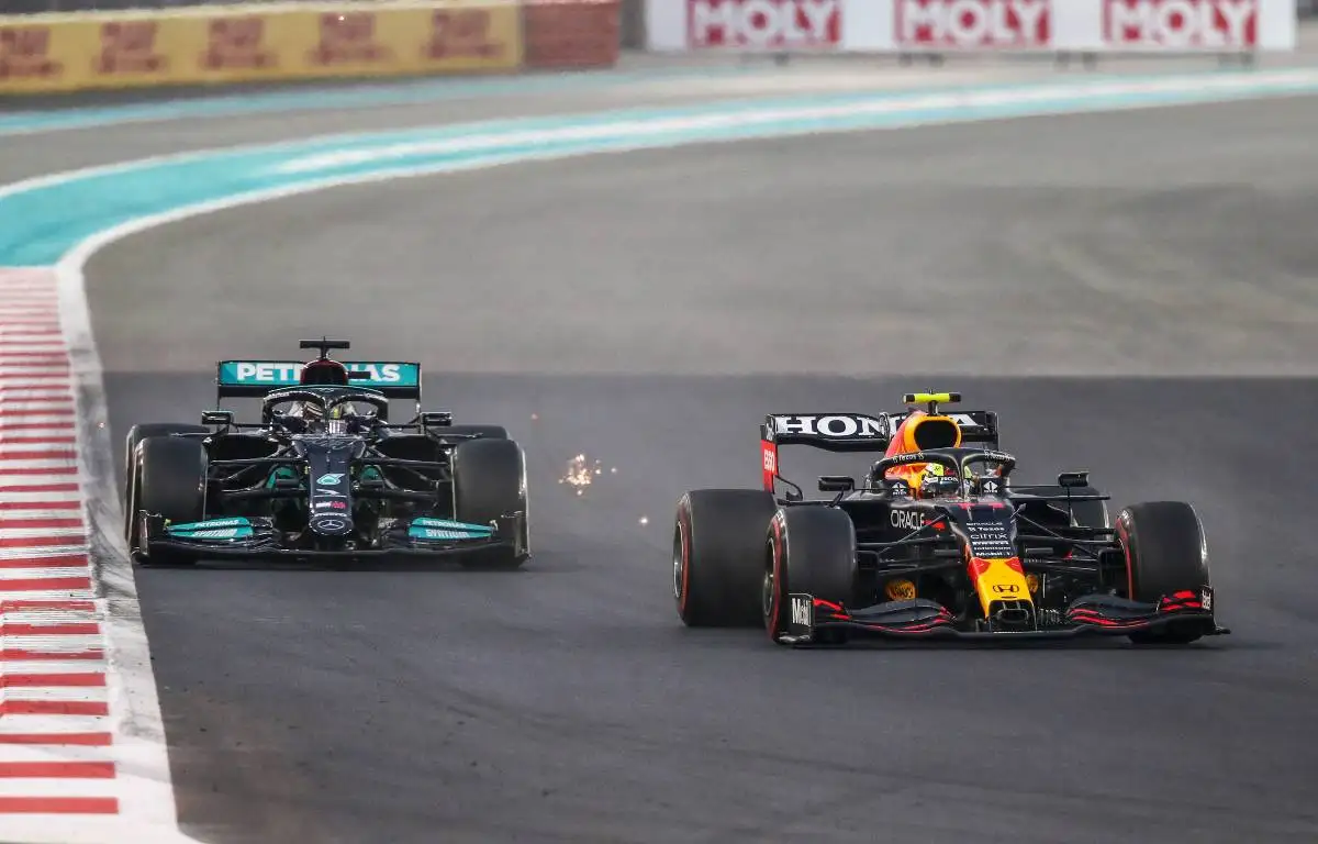 Sergio Perez defending against Lewis Hamilton in Abu Dhabi GP. Yas Marina December 2021.